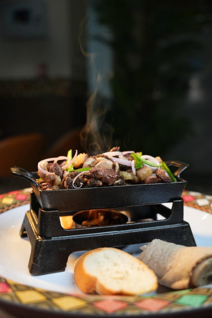 Hot Ethiopian meat dish served at the table